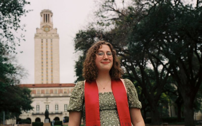 Sara Schleede poses in Main Mall in front of UT Tower