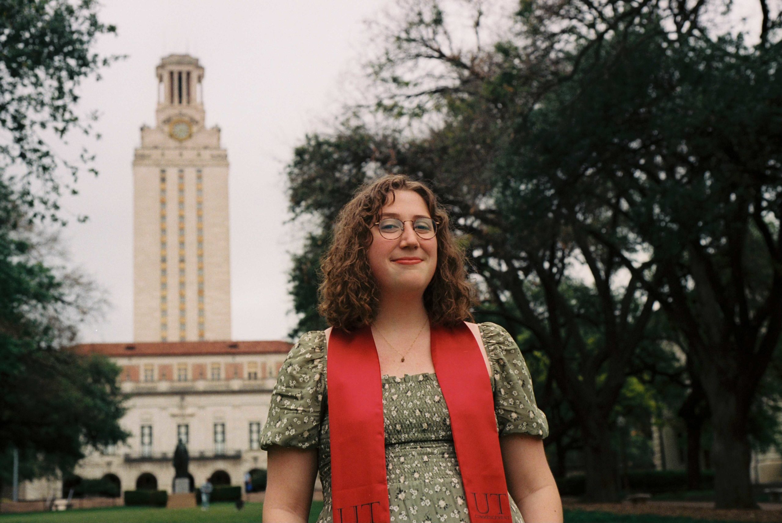 Sara Schleede poses in Main Mall in front of UT Tower