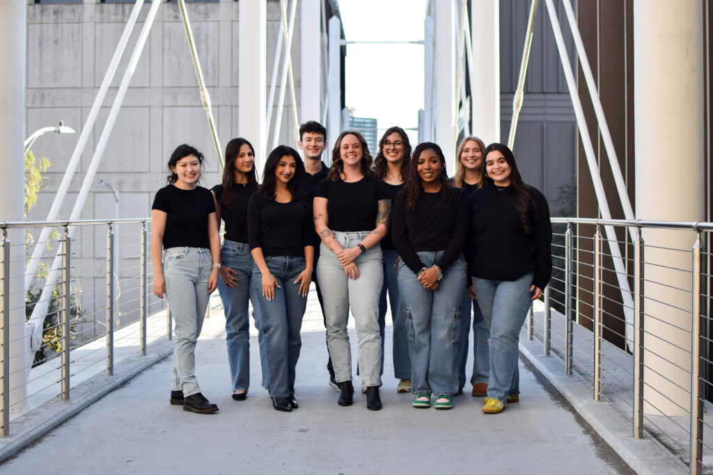 Group photo of The Drag’s leadership team standing together, smiling at the camera.