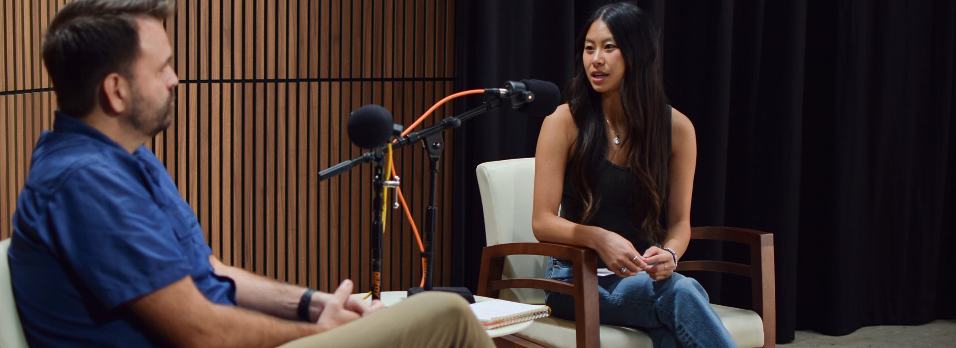 Student podcast host talking with guest